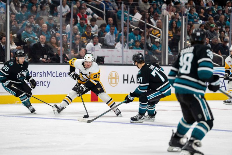 Oct 18, 2025; San Jose, California, USA; Pittsburgh Penguins center Sidney Crosby (87) controls the puck against San Jose Sharks center Michael Misa (77) during the second period at SAP Center at San Jose. Mandatory Credit: Neville E. Guard-Imagn Images