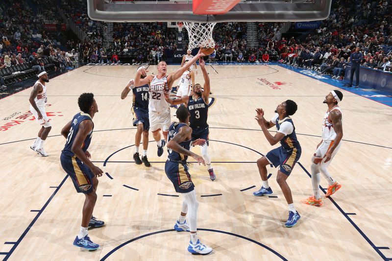 NEW ORLEANS, LA - DECEMBER 5: Mason Plumlee #22 of the Phoenix Suns grabs the rebound during the game against the New Orleans Pelicans on December 5, 2024 at the Smoothie King Center in New Orleans, Louisiana. NOTE TO USER: User expressly acknowledges and agrees that, by downloading and or using this Photograph, user is consenting to the terms and conditions of the Getty Images License Agreement. Mandatory Copyright Notice: Copyright 2024 NBAE (Photo by Layne Murdoch Jr./NBAE via Getty Images)