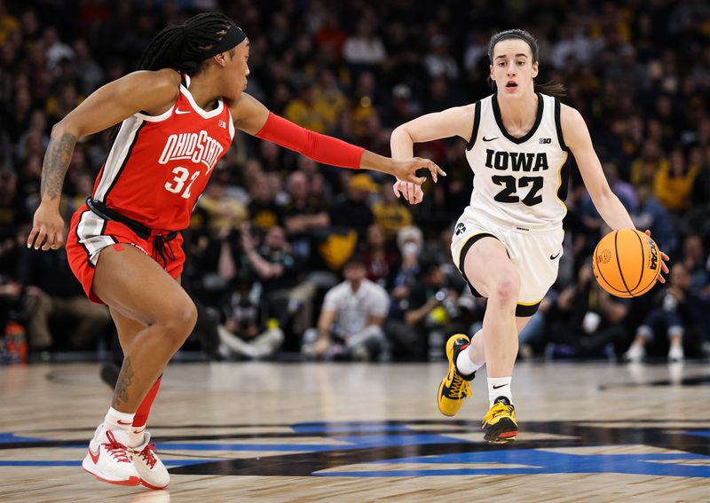 Mar 5, 2023; Minneapolis, MINN, USA; Iowa Hawkeyes guard Caitlin Clark (22) dribbles while Ohio State Buckeyes forward Cotie McMahon (32) defends during the first half at Target Center. Mandatory Credit: Matt Krohn-USA TODAY Sports