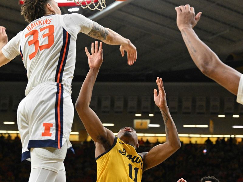 Mar 10, 2024; Iowa City, Iowa, USA; Illinois Fighting Illini forward Coleman Hawkins (33) blocks the shot of Iowa Hawkeyes guard Tony Perkins (11) as forward Quincy Guerrier (13) looks on during the second half at Carver-Hawkeye Arena. Mandatory Credit: Jeffrey Becker-USA TODAY Sports