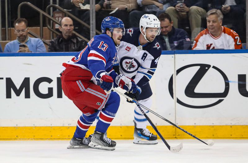 Mar 19, 2024; New York, New York, USA; Winnipeg Jets defenseman Josh Morrissey (44) and New York Rangers forward Alexis Lafreniere (13) battle along the boards during the first period at Madison Square Garden. Mandatory Credit: Danny Wild-USA TODAY Sports