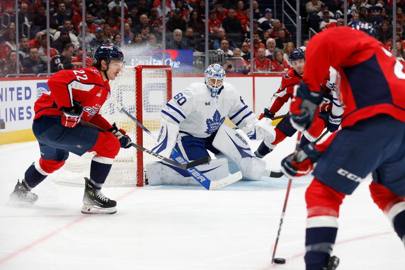 Nov 13, 2024; Washington, District of Columbia, USA; Toronto Maple Leafs goaltender Joseph Woll (60) prepares to make a save on Washington Capitals center Nic Dowd (26) in the third period at Capital One Arena. Mandatory Credit: Geoff Burke-Imagn Images