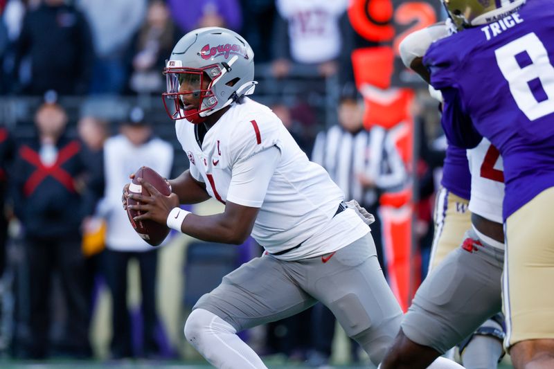 Nov 25, 2023; Seattle, Washington, USA; Washington State Cougars quarterback Cameron Ward (1) scrambles out of the pocket against the Washington Huskies during the first quarter at Alaska Airlines Field at Husky Stadium. Mandatory Credit: Joe Nicholson-USA TODAY Sports