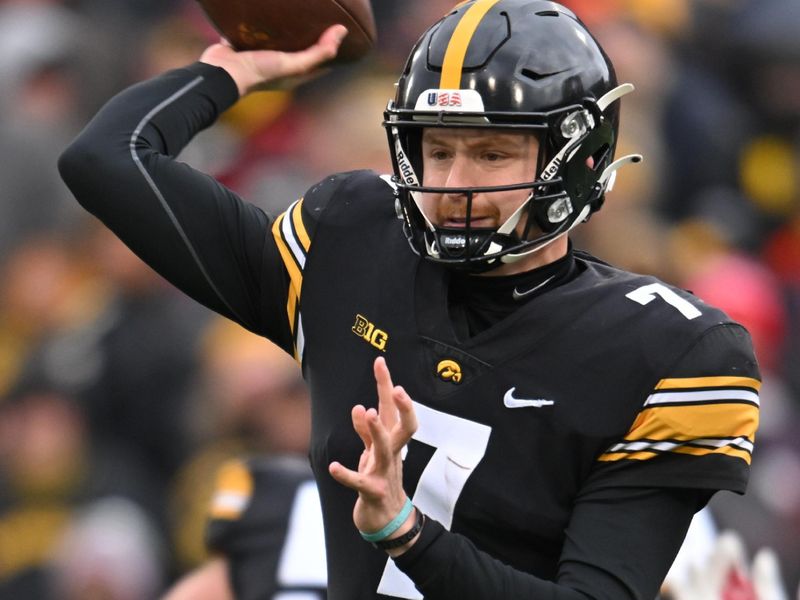 Nov 12, 2022; Iowa City, Iowa, USA; Iowa Hawkeyes quarterback Spencer Petras (7) throws a pass against the Wisconsin Badgers during the first quarter at Kinnick Stadium. Mandatory Credit: Jeffrey Becker-USA TODAY Sports