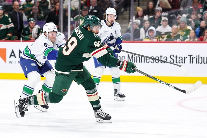 Dec 3, 2024; Saint Paul, Minnesota, USA; Minnesota Wild center Frederick Gaudreau (89) scores a goal against the Vancouver Canucks during the second period at Xcel Energy Center. Mandatory Credit: Matt Krohn-Imagn Images