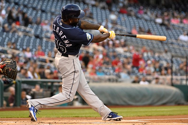 Apr 4, 2023; Washington, District of Columbia, USA; Tampa Bay Rays left fielder Randy Arozarena (56) hits an RBI double against the Washington Nationals during the first inning at Nationals Park. Mandatory Credit: Brad Mills-USA TODAY Sports