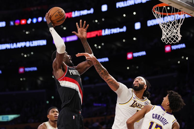 LOS ANGELES, CALIFORNIA - DECEMBER 08: Deandre Ayton #2 of the Portland Trail Blazers drives to the basket defended by Anthony Davis #3 of the Los Angeles Lakers in the first half at Crypto.com Arena on December 08, 2024 in Los Angeles, California. NOTE TO USER: User expressly acknowledges and agrees that, by downloading and or using this Photograph, user is consenting to the terms and conditions of the Getty Images License Agreement. (Photo by Meg Oliphant/Getty Images)