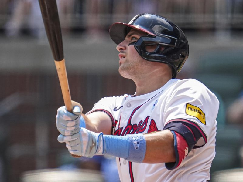 Jun 16, 2024; Cumberland, Georgia, USA; Atlanta Braves third baseman Austin Riley (27) hits a game tying two run home run against the Tampa Bay Rays during the eighth inning at Truist Park. Mandatory Credit: Dale Zanine-USA TODAY Sports