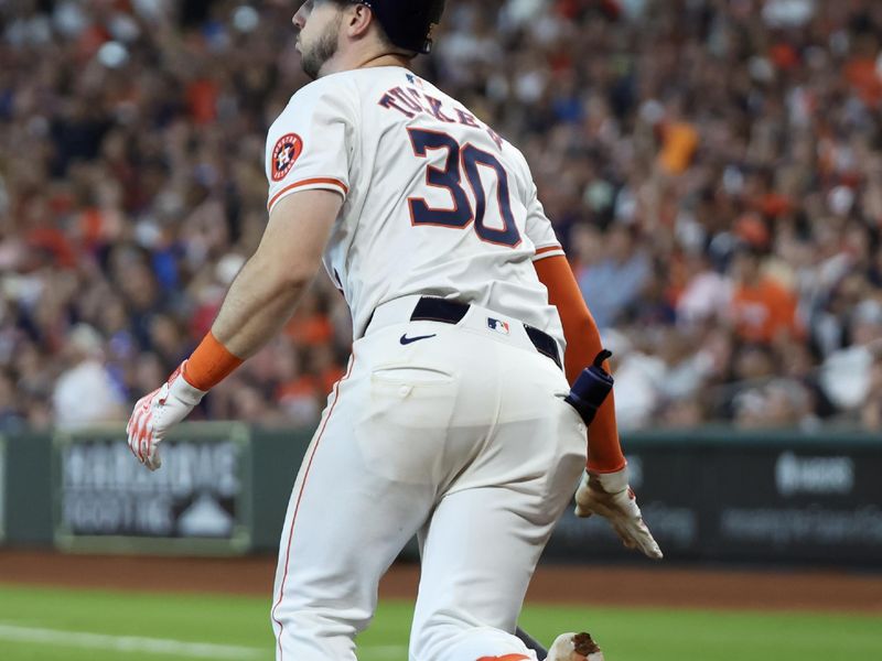 Apr 13, 2024; Houston, Texas, USA;  Houston Astros right fielder Kyle Tucker (30) hits a sacrifice RBI against the Texas Rangers in the seventh inning at Minute Maid Park. Mandatory Credit: Thomas Shea-USA TODAY Sports