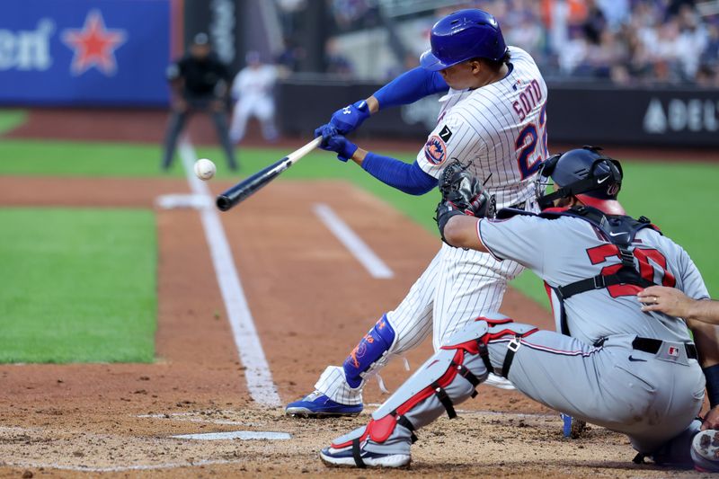 Jun 10, 2025; New York City, New York, USA; New York Mets right fielder Juan Soto (22) hits a solo home run against the Washington Nationals during the third inning at Citi Field. Mandatory Credit: Brad Penner-Imagn Images
