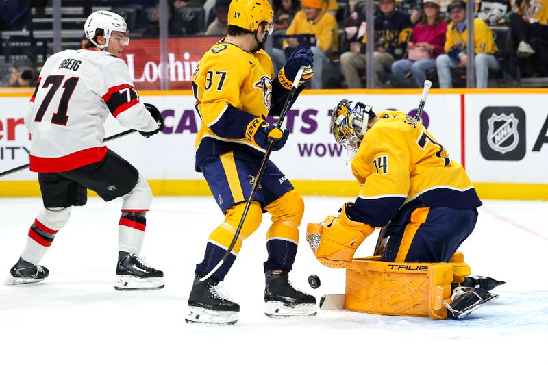 Jan 22, 2026; Nashville, Tennessee, USA;  Nashville Predators goaltender Juuse Saros (74) blocks the shot of Ottawa Senators center Ridly Greig (71) during the second period at Bridgestone Arena. Mandatory Credit: Steve Roberts-Imagn Images