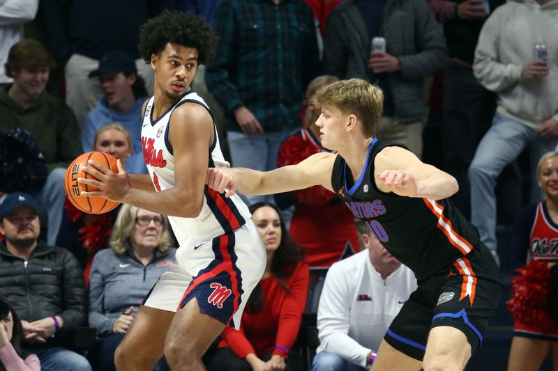 Jan 10, 2024; Oxford, Mississippi, USA; Mississippi Rebels forward Jaemyn Brakefield (4) handles the ball as Florida Gators forward Thomas Haugh (10) defends during the first half at The Sandy and John Black Pavilion at Ole Miss. Mandatory Credit: Petre Thomas-USA TODAY Sports