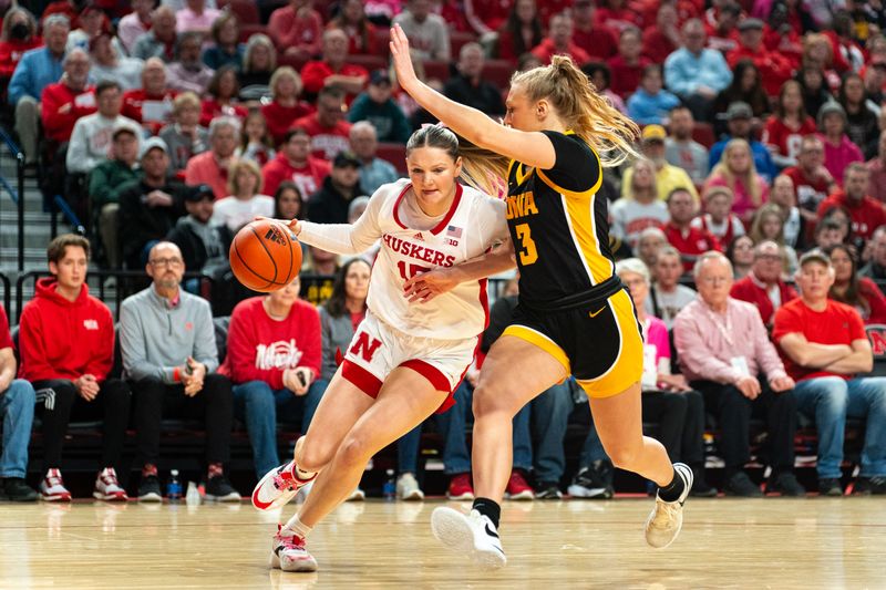 Feb 11, 2024; Lincoln, Nebraska, USA; Nebraska Cornhuskers guard Kendall Moriarty (15) drives against Iowa Hawkeyes guard Sydney Affolter (3) during the first quarter at Pinnacle Bank Arena. Mandatory Credit: Dylan Widger-USA TODAY Sports