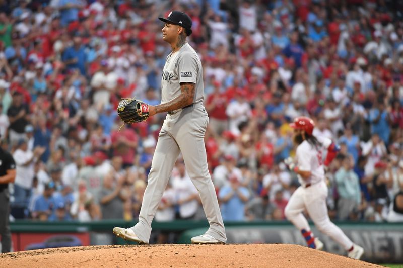 Jul 29, 2024; Philadelphia, Pennsylvania, USA; New York Yankees pitcher Luis Gil (81) waist for a new baseball after allowing home run by Philadelphia Phillies outfielder Brandon Marsh (16) during the fourth inning at Citizens Bank Park. Mandatory Credit: Eric Hartline-USA TODAY Sports
