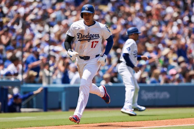 Jun 5, 2025; Los Angeles, California, USA; Los Angeles Dodgers two-way player Shohei Ohtani (17) runs in to score during the third inning against the New York Mets at Dodger Stadium. Mandatory Credit: Jason Parkhurst-Imagn Images