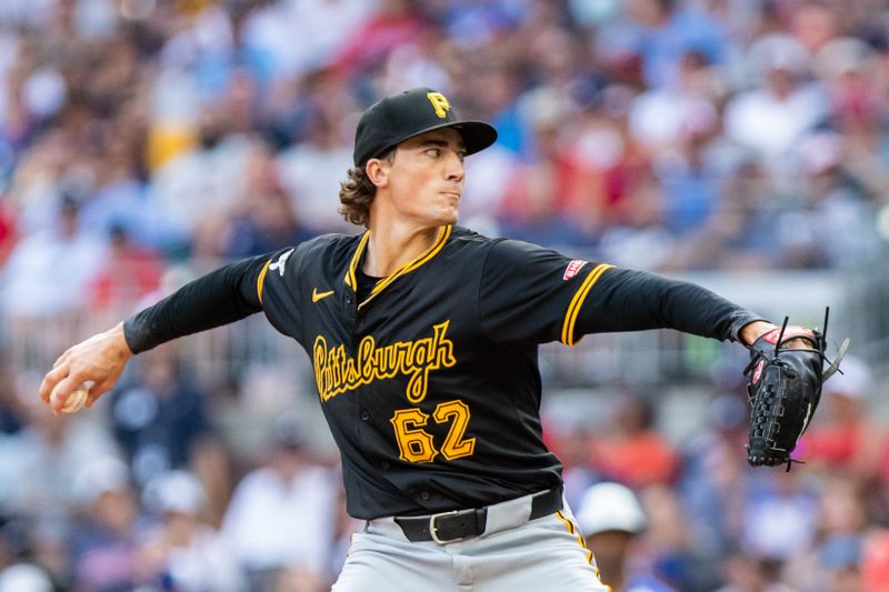 Jun 29, 2024; Cumberland, Georgia, USA; Pittsburgh Pirates pitcher Kyle Nicolas (62) pitches the ball against Atlanta Braves during the tenth inning at Truist Park. Mandatory Credit: Jordan Godfree-USA TODAY Sports