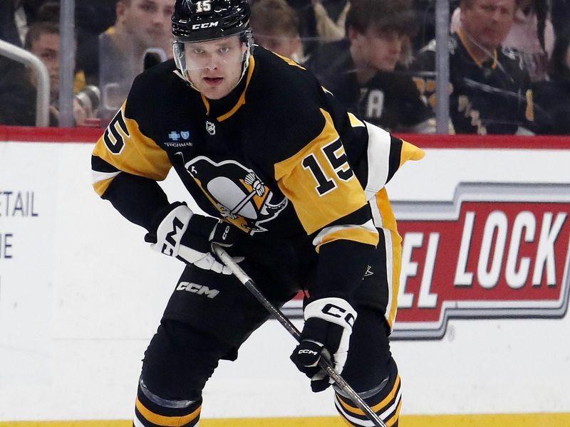 Mar 5, 2024; Pittsburgh, Pennsylvania, USA; Pittsburgh Penguins left wing Joona Koppanen (15) skates with the puck against the Columbus Blue Jackets during the third period at PPG Paints Arena. The Penguins won 5-3. Mandatory Credit: Charles LeClaire-USA TODAY Sports