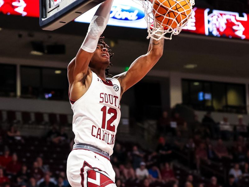 Mar 4, 2023; Columbia, South Carolina, USA; South Carolina Gamecocks guard Zachary Davis (12) dunks against the Georgia Bulldogs in the first half at Colonial Life Arena. Mandatory Credit: Jeff Blake-USA TODAY Sports