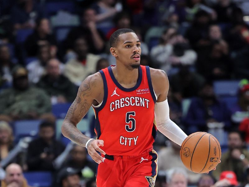 NEW ORLEANS, LOUISIANA - DECEMBER 12: Dejounte Murray #5 of the New Orleans Pelicans drives with the ball against the Sacramento Kings during a game at the Smoothie King Center on December 12, 2024 in New Orleans, Louisiana. NOTE TO USER: User expressly acknowledges and agrees that, by downloading and or using this Photograph, user is consenting to the terms and conditions of the Getty Images License Agreement. (Photo by Jonathan Bachman/Getty Images)