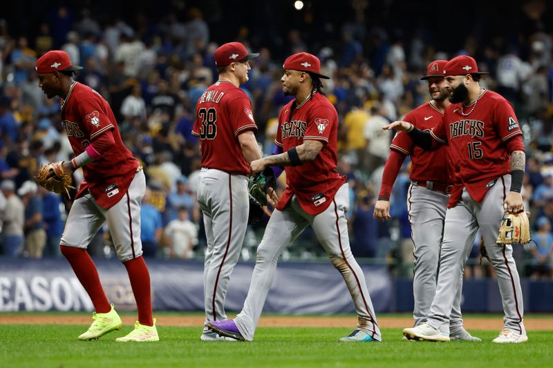 Oct 4, 2023; Milwaukee, Wisconsin, USA; Arizona Diamondbacks second baseman Ketel Marte (4) celebrates with teammates after winning against the Milwaukee Brewers in game two of the Wildcard series for the 2023 MLB playoffs at American Family Field. Mandatory Credit: Kamil Krzaczynski-USA TODAY Sports