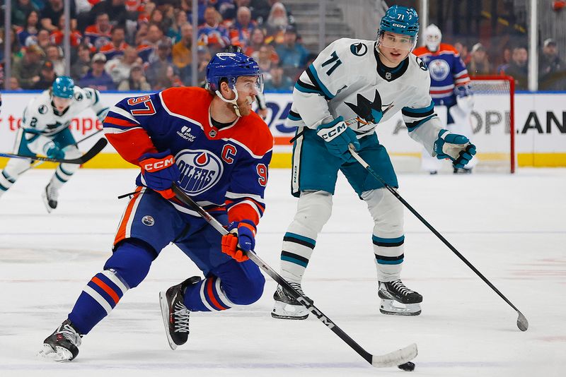 Jan 29, 2026; Edmonton, Alberta, CAN; Edmonton Oilers forward Connor McDavid (97) looks to make a pass in front of San Jose Sharks forward Macklin Celebrini (71) during the first period at Rogers Place. Mandatory Credit: Perry Nelson-Imagn Images