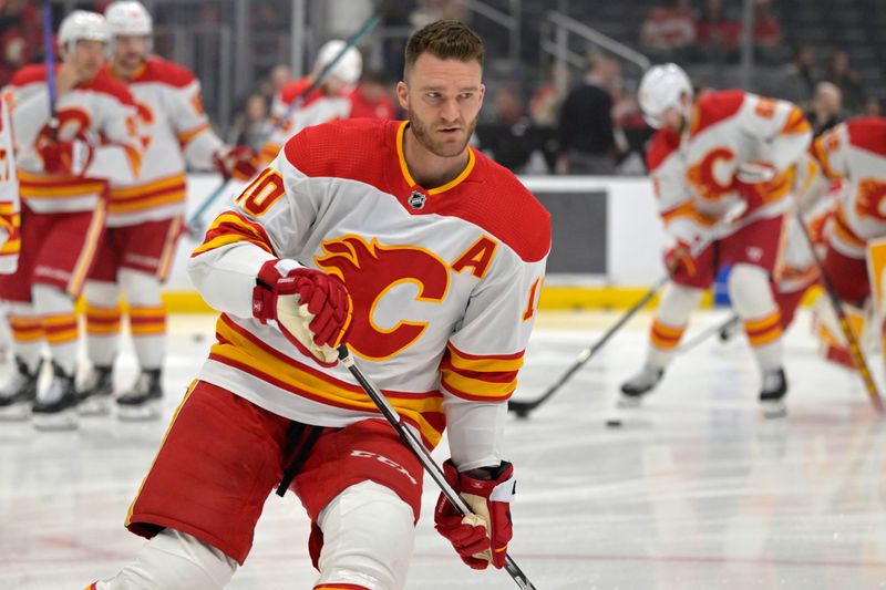 Apr 11, 2024; Los Angeles, California, USA;  Calgary Flames center Jonathan Huberdeau (10) warms up prior to the game against the Los Angeles Kings at Crypto.com Arena. Mandatory Credit: Jayne Kamin-Oncea-USA TODAY Sports