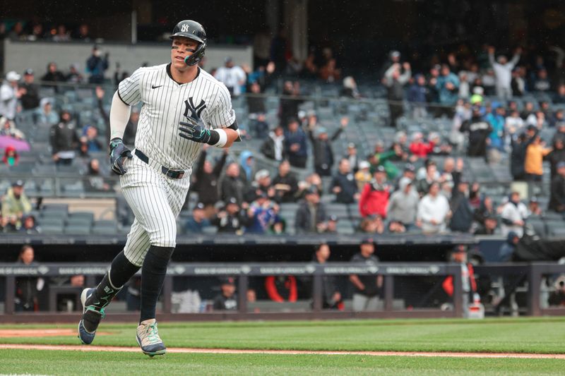 May 5, 2024; Bronx, New York, USA; New York Yankees center fielder Aaron Judge (99) runs the bases during his solo home run during the first inning against the Detroit Tigers at Yankee Stadium. Mandatory Credit: Vincent Carchietta-USA TODAY Sports