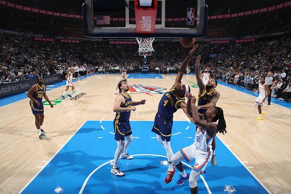 OKLAHOMA CITY, OK - DECEMBER 8: Moses Moody #4 of the Golden State Warriors grabs a rebound during the game against the Oklahoma City Thunder on December 8, 2023 at Paycom Arena in Oklahoma City, Oklahoma. NOTE TO USER: User expressly acknowledges and agrees that, by downloading and or using this photograph, User is consenting to the terms and conditions of the Getty Images License Agreement. Mandatory Copyright Notice: Copyright 2023 NBAE (Photo by Zach Beeker/NBAE via Getty Images)