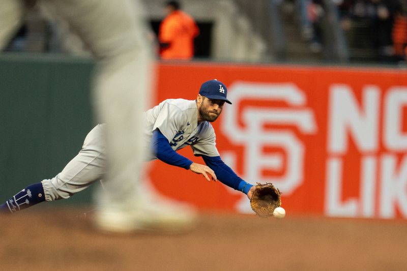 Sep 30, 2023; San Francisco, California, USA; Los Angeles Dodgers shortstop Chris Taylor (3) dives for the ball hit by San Francisco Giants right fielder Luis Matos (not pictured) during the third inning at Oracle Park. Mandatory Credit: Neville E. Guard-USA TODAY Sports