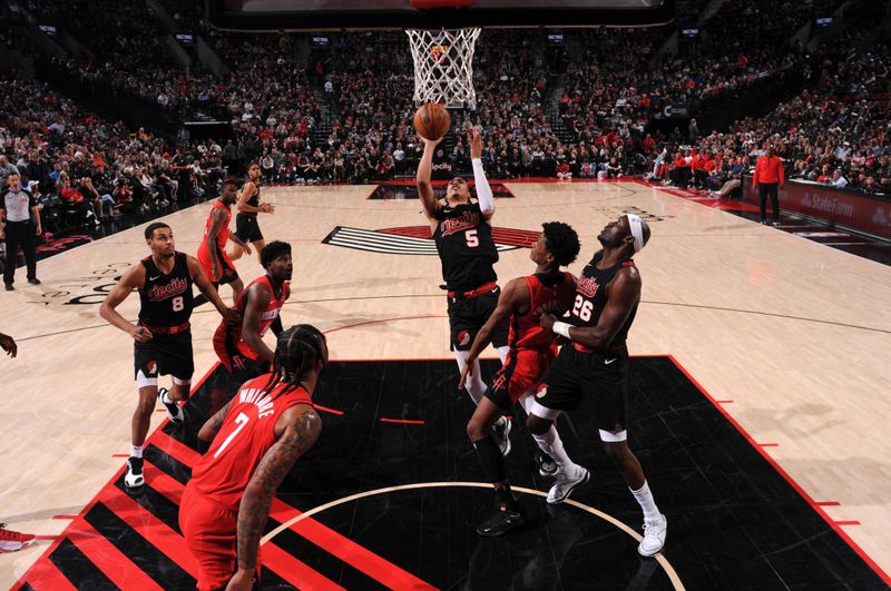 PORTLAND, OR - APRIL 12: Dalano Banton #5 of the Portland Trail Blazers shoots the ball during the game against the Houston Rockets on April 12, 2024 at the Moda Center Arena in Portland, Oregon. NOTE TO USER: User expressly acknowledges and agrees that, by downloading and or using this photograph, user is consenting to the terms and conditions of the Getty Images License Agreement. Mandatory Copyright Notice: Copyright 2024 NBAE (Photo by Cameron Browne/NBAE via Getty Images)