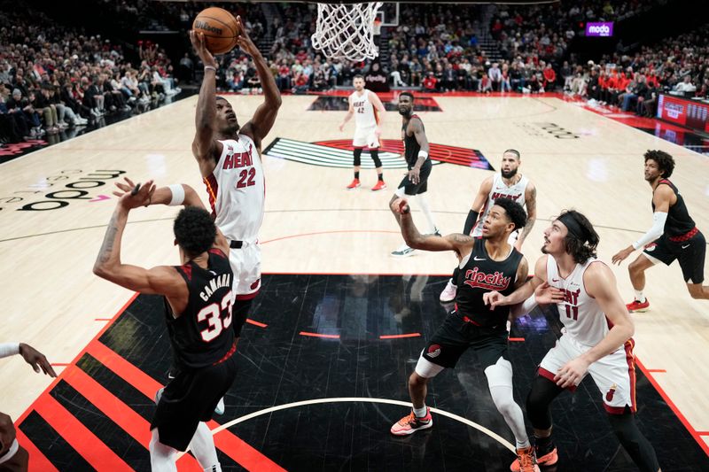 PORTLAND, OREGON - FEBRUARY 27: Jimmy Butler #22 of the Miami Heat shoots the ball against Toumani Camara #33 of the Portland Trail Blazers during the first half at Moda Center on February 27, 2024 in Portland, Oregon. NOTE TO USER: User expressly acknowledges and agrees that, by downloading and or using this photograph, User is consenting to the terms and conditions of the Getty Images License Agreement. (Photo by Soobum Im/Getty Images)