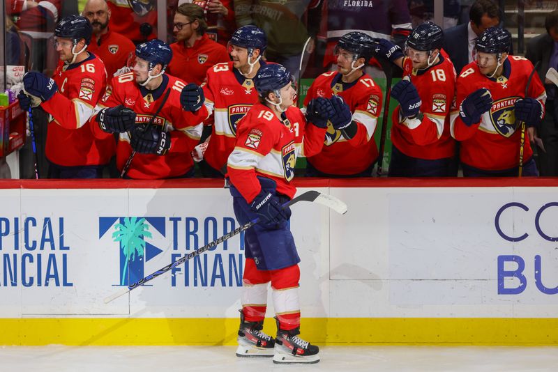 Apr 11, 2024; Sunrise, Florida, USA; Florida Panthers left wing Matthew Tkachuk (19) celebrates with teammates after scoring against the Columbus Blue Jackets during the first period at Amerant Bank Arena. Mandatory Credit: Sam Navarro-USA TODAY Sports