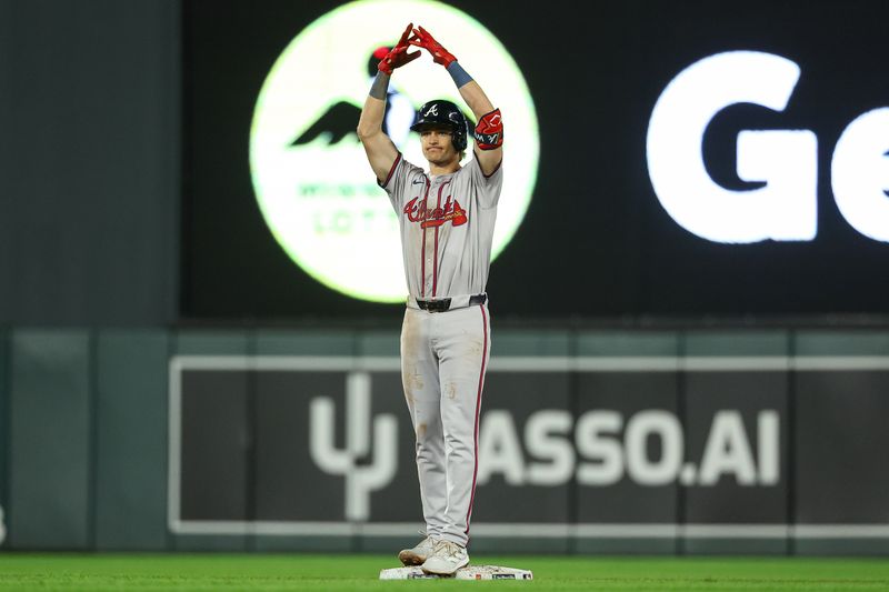 Aug 28, 2024; Minneapolis, Minnesota, USA; Atlanta Braves third baseman Luke Williams (65) celebrates his two RBI double against the Minnesota Twins during the seventh inning at Target Field. Mandatory Credit: Matt Krohn-USA TODAY Sports