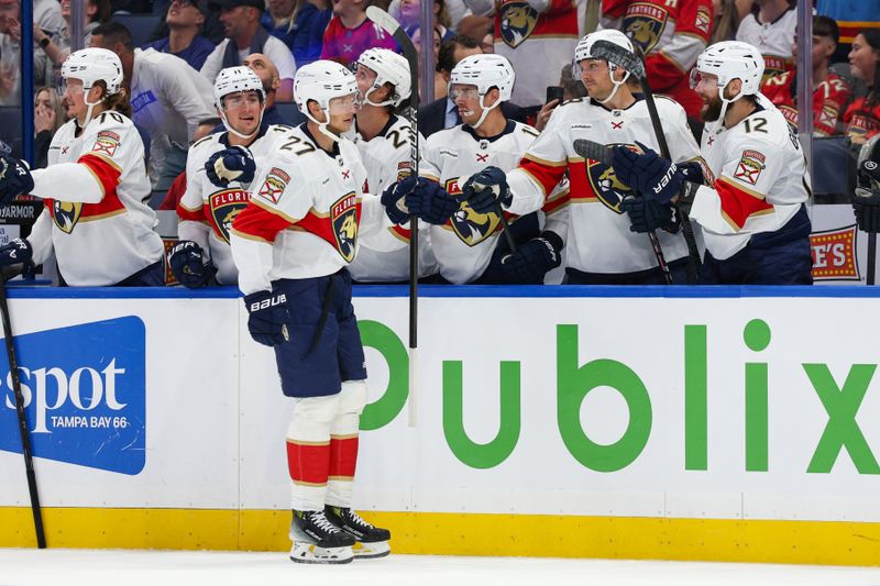Oct 2, 2025; Tampa, Florida, USA; Florida Panthers center Eetu Luostarinen (27) reacts after scoring a goal against the Tampa Bay Lightning in the first period at Benchmark International Arena. Mandatory Credit: Nathan Ray Seebeck-Imagn Images