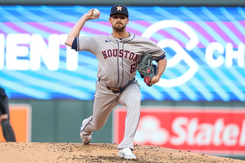 Jul 5, 2024; Minneapolis, Minnesota, USA; Houston Astros pitcher Seth Martinez (61) pitches against the Minnesota Twins during the third inning at Target Field. Mandatory Credit: Matt Krohn-USA TODAY Sports