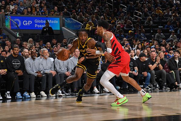 SAN FRANCISCO, CA - DECEMBER 23: Jonathan Kuminga #00 of the Golden State Warriors drives to the basket during the game against the Portland Trail Blazers on December 23, 2023 at Chase Center in San Francisco, California. NOTE TO USER: User expressly acknowledges and agrees that, by downloading and or using this photograph, user is consenting to the terms and conditions of Getty Images License Agreement. Mandatory Copyright Notice: Copyright 2023 NBAE (Photo by Noah Graham/NBAE via Getty Images)