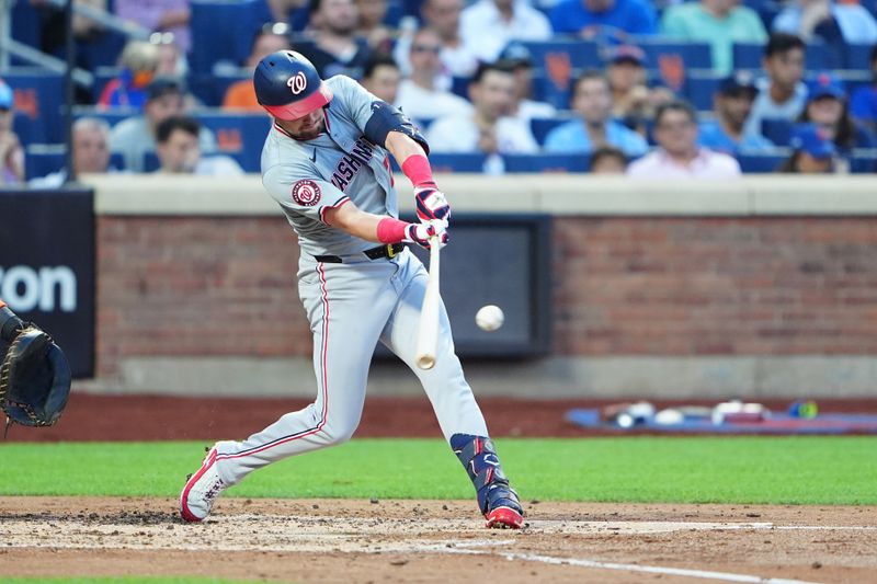 Jul 10, 2024; New York City, New York, USA; Washington Nationals right fielder Lane Thomas (28) hits a single against the New York Mets during the fourth inning at Citi Field. Mandatory Credit: Gregory Fisher-USA TODAY Sports