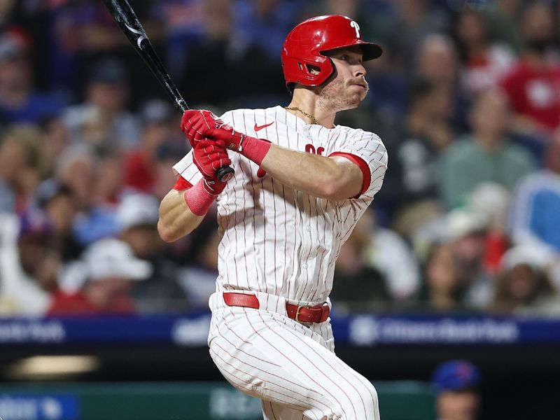 Sep 10, 2025; Philadelphia, Pennsylvania, USA; Philadelphia Phillies outfielder Max Kepler (17) hits a two RBI single against the New York Mets during the sixth inning at Citizens Bank Park. Mandatory Credit: Bill Streicher-Imagn Images