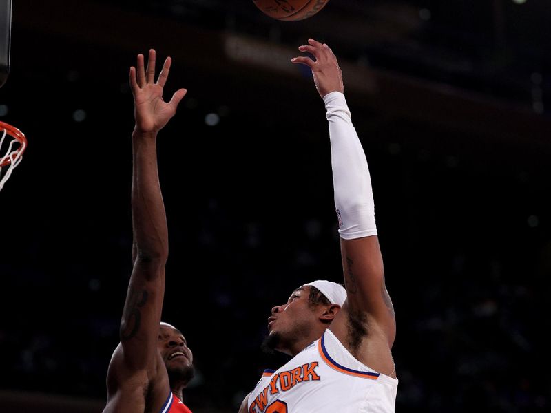 NEW YORK, NEW YORK - APRIL 20: Miles McBride #2 of the New York Knicks heads for the net as Paul Reed #44 of the Philadelphia 76ers defends during the second half in game one of the Eastern Conference First Round Playoffs at Madison Square Garden on April 20, 2024 in New York City. The New York Knicks defeated the Philadelphia 76ers 111-104. NOTE TO USER: User expressly acknowledges and agrees that, by downloading and or using this photograph, User is consenting to the terms and conditions of the Getty Images License Agreement. (Photo by Elsa/Getty Images)