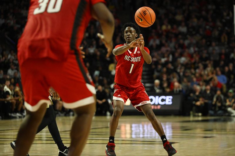 Jan 28, 2023; Winston-Salem, North Carolina, USA;  North Carolina State Wolfpack guard Jarkel Joiner (1) passes to North Carolina State Wolfpack forward D.J. Burns Jr. (30) during the second half at Lawrence Joel Veterans Memorial Coliseum. Mandatory Credit: William Howard-USA TODAY Sports