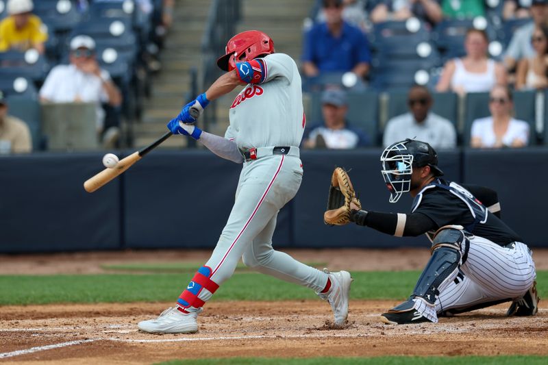 Mar 14, 2026; Tampa, Florida, USA; Philadelphia Phillies third baseman Christian Cairo (70) singles against the New York Yankees in the third inning during spring training at George M. Steinbrenner Field. Mandatory Credit: Nathan Ray Seebeck-Imagn Images