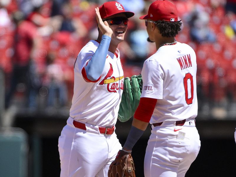 May 7, 2025; St. Louis, Missouri, USA;  St. Louis Cardinals left fielder Lars Nootbaar (21) celebrates with shortstop Masyn Winn (0) after the Cardinals defeated the Pittsburgh Pirates at Busch Stadium. Mandatory Credit: Jeff Curry-Imagn Images