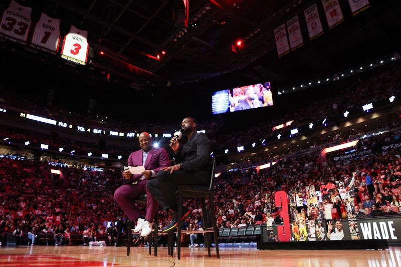 MIAMI, FLORIDA - JANUARY 14: Former Miami Heat player Dwayne Wade addresses the crowd during his Hall of Fame night during halftime between the Charlotte Hornets and Miami Heat at Kaseya Center on January 14, 2024 in Miami, Florida. NOTE TO USER: User expressly acknowledges and agrees that, by downloading and or using this photograph, User is consenting to the terms and conditions of the Getty Images License Agreement.  (Photo by Megan Briggs/Getty Images)