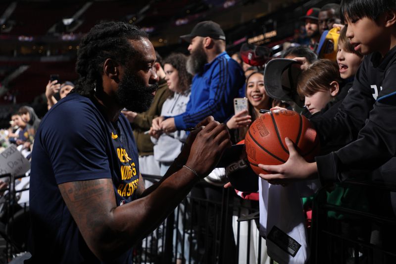 PORTLAND, OR - MARCH 23: DeAndre Jordan #6 of the Denver Nuggets signs autographs before the game against the Portland Trail Blazers on March 23, 2024 at the Moda Center Arena in Portland, Oregon. NOTE TO USER: User expressly acknowledges and agrees that, by downloading and or using this photograph, user is consenting to the terms and conditions of the Getty Images License Agreement. Mandatory Copyright Notice: Copyright 2024 NBAE (Photo by Cameron Browne/NBAE via Getty Images)