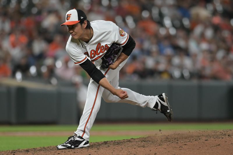 Aug 23, 2023; Baltimore, Maryland, USA;  Baltimore Orioles relief pitcher Shintaro Fujinami (14) delivers a ninth inning pitch against the Toronto Blue Jays at Oriole Park at Camden Yards. Mandatory Credit: Tommy Gilligan-USA TODAY Sports