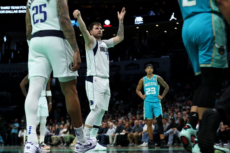 CHARLOTTE, NORTH CAROLINA - APRIL 09: Luka Doncic #77 of the Dallas Mavericks shoots a free throw during the second half of an NBA game against the Charlotte Hornets at Spectrum Center on April 09, 2024 in Charlotte, North Carolina. NOTE TO USER: User expressly acknowledges and agrees that, by downloading and or using this photograph, User is consenting to the terms and conditions of the Getty Images License Agreement. (Photo by David Jensen/Getty Images)