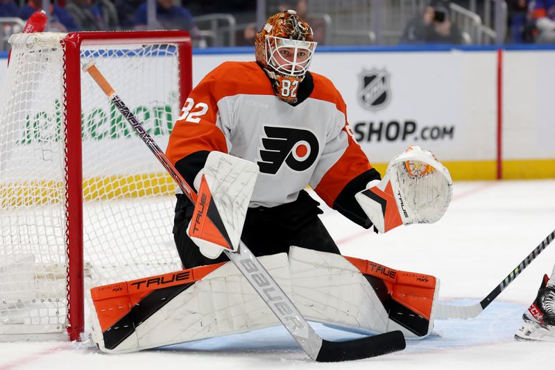 Jan 24, 2025; Elmont, New York, USA; Philadelphia Flyers goaltender Ivan Fedotov (82) tends net against the New York Islanders during the second period at UBS Arena. Mandatory Credit: Brad Penner-Imagn Images