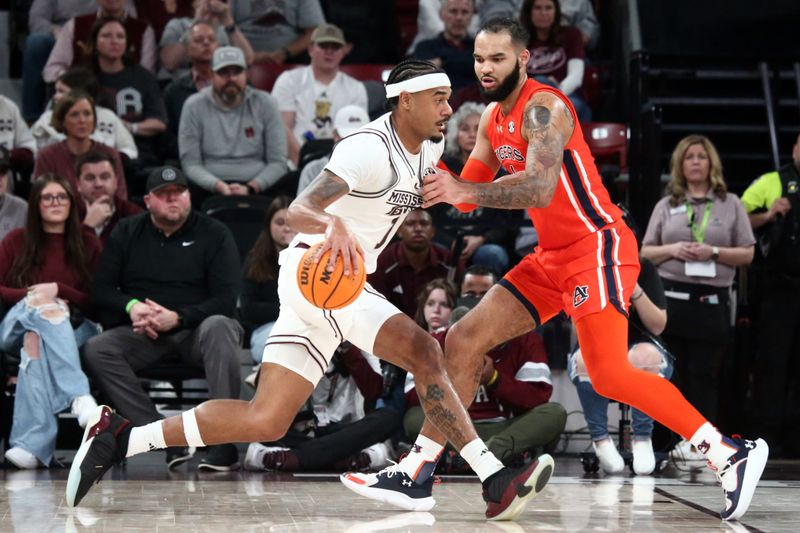 Jan 27, 2024; Starkville, Mississippi, USA; Mississippi State Bulldogs forward Tolu Smith (1) drives to the basket as Auburn Tigers forward/center Johni Broome (4) defends during the first half at Humphrey Coliseum. Mandatory Credit: Petre Thomas-USA TODAY Sports