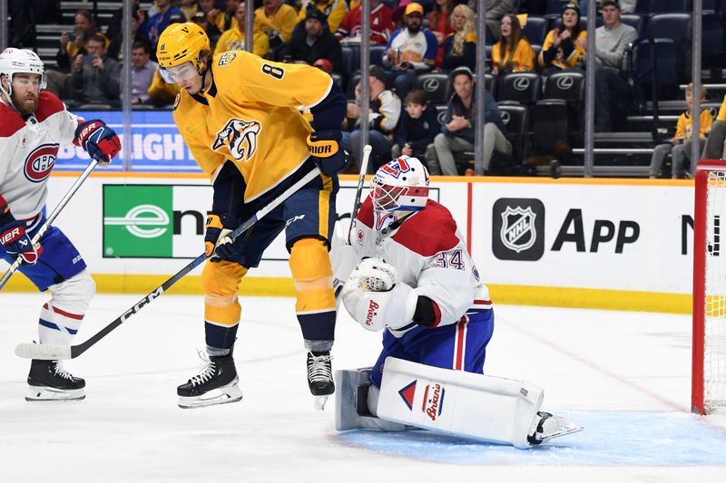 Mar 5, 2024; Nashville, Tennessee, USA; Nashville Predators center Cody Glass (8) tries a jump screen in front of Montreal Canadiens goaltender Jake Allen (34) in a shot during the first period at Bridgestone Arena. Mandatory Credit: Christopher Hanewinckel-USA TODAY Sports