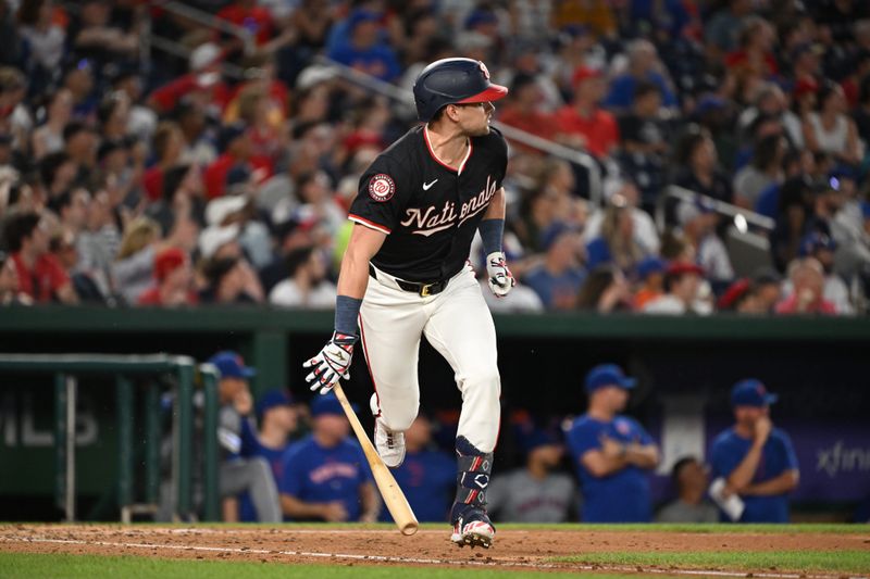 Jul 3, 2024; Washington, District of Columbia, USA; Washington Nationals right fielder Lane Thomas (28) watches the ball after hitting a double against the New York Mets during the seventh inning at Nationals Park. Mandatory Credit: Rafael Suanes-USA TODAY Sports